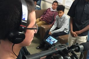 Student videographer films interviews